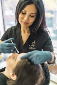 Dr. Sameea injecting a patient with Botox at Aesthetic Skin New York