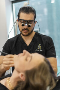 Dr. Anil Shah of Noses and Necks New York with a patient at a plastic surgery consultation in New York City